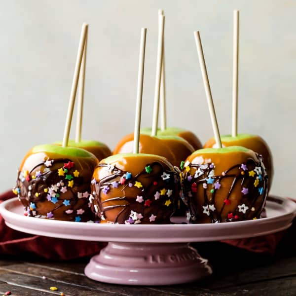 homemade caramel apples decorated with chocolate and sprinkles