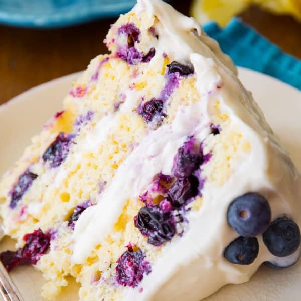 picture of a slice of lemon blueberry layer cake