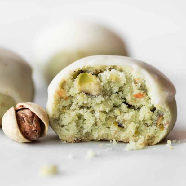 round light green pistachio cookie with icing