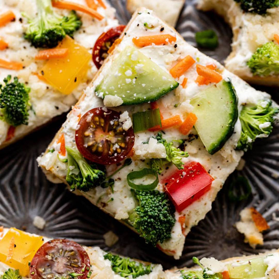 Slice of cold veggie pizza