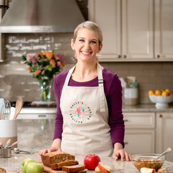 Sally with apples and bread on counter