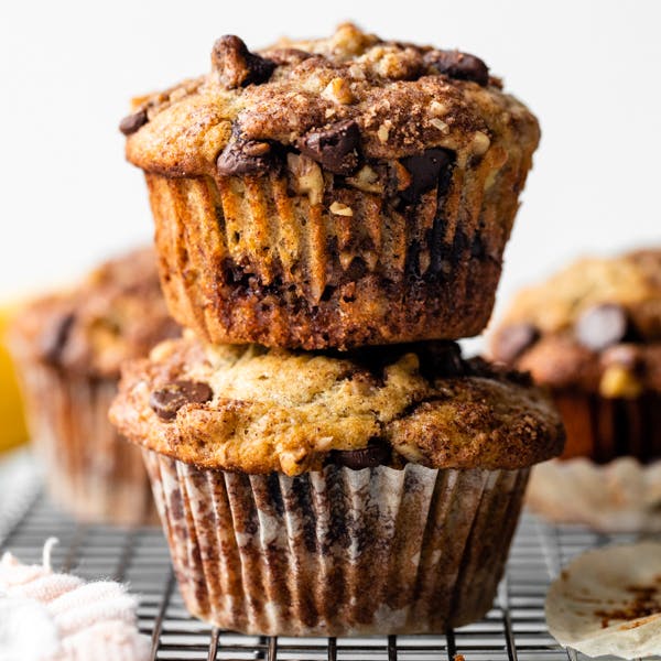 picture of two banana chocolate chip muffins with streusel topping