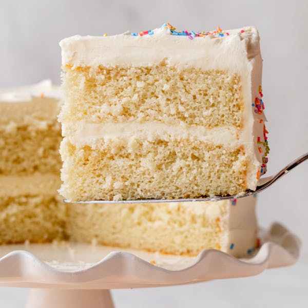 slice of a 2-layer white cake with vanilla buttercream