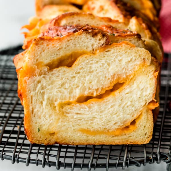 sliced cheese bread showing ribbons of cheese throughout