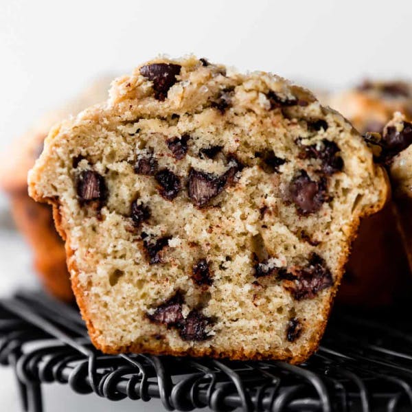 jumbo muffin cut in half showing lots of chocolate chips 