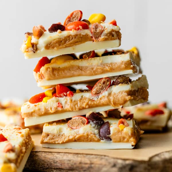 stack of white chocolate bark with peanut butter and Reese's Pieces