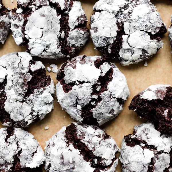 chocolate crinkle cookies on parchment paper