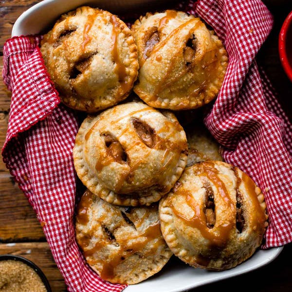 picture of apple hand pies drizzled with caramel sauce