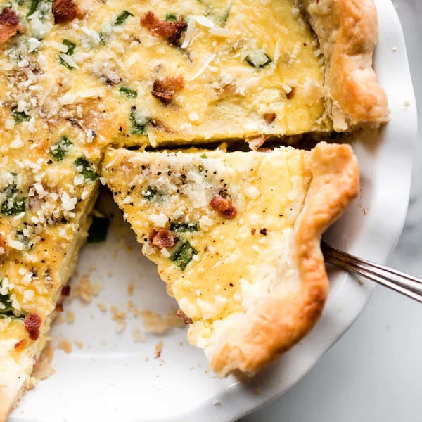 slice of quiche in a pie dish