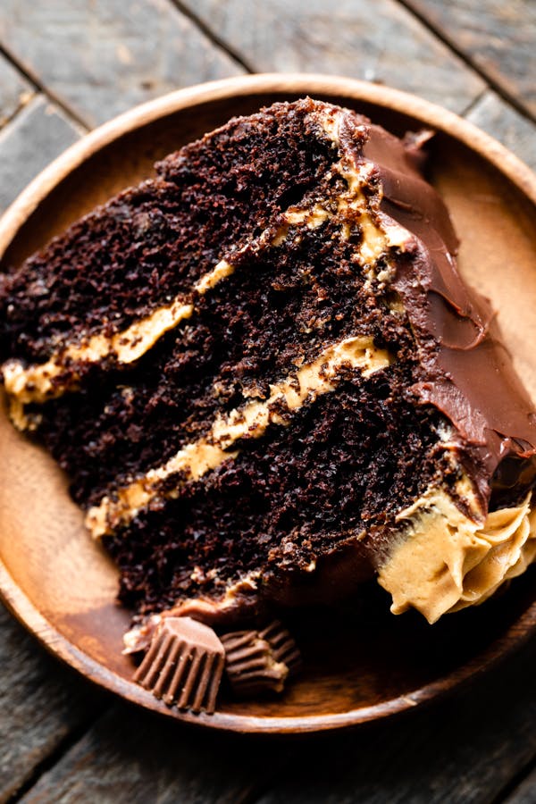 slice of chocolate cake with peanut butter frosting and ganache