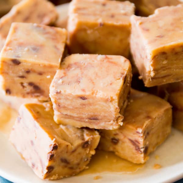 squares of peanut butter fudge stacked on a plate
