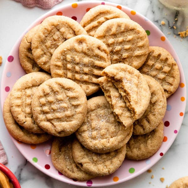 pink plate with classic peanut butter cookies