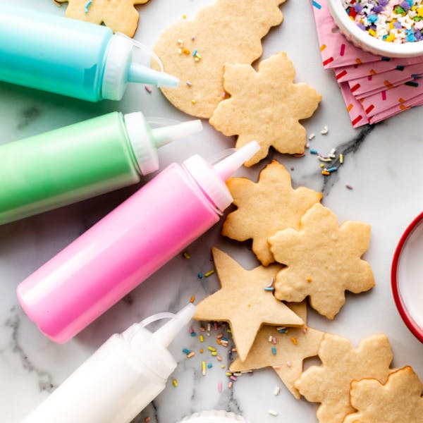 sugar cookies and icing in squeeze bottles