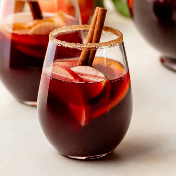 Honeycrisp apple sangria garnished with a cinnamon stick