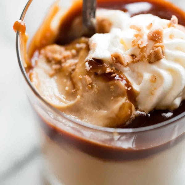 butterscotch pudding with whipped cream on top