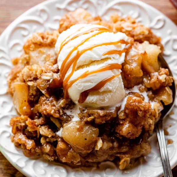 picture of apple crisp with vanilla ice cream and caramel sauce 