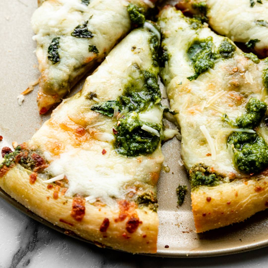 picture of a slice of homemade pesto pizza