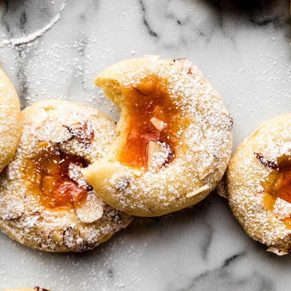 picture of cookies with apricot jam filling and almonds