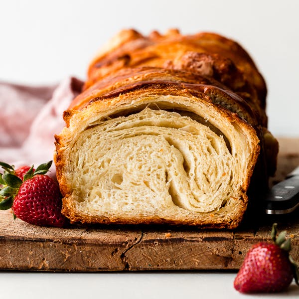 Photo of sliced croissant bread loaf showing flaky layers