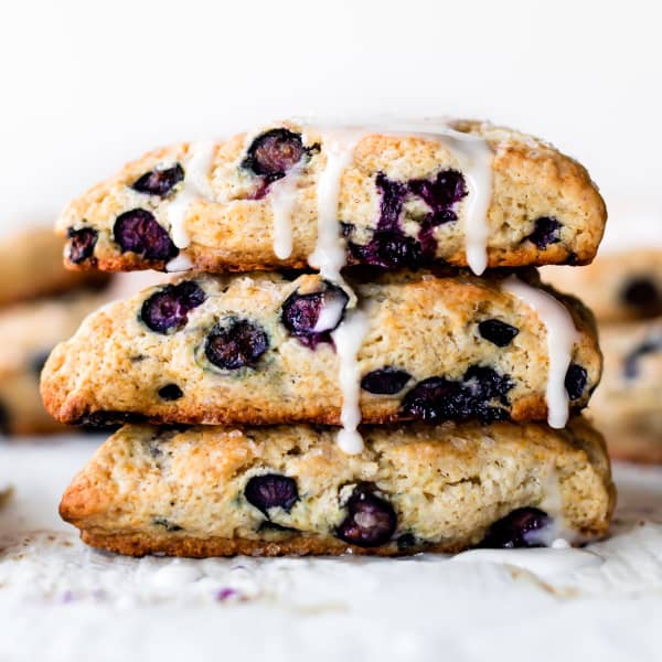 picture of a stack of 3 blueberry scones with icing