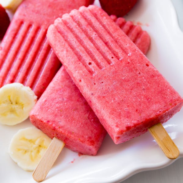 pink popsicles on a white plate