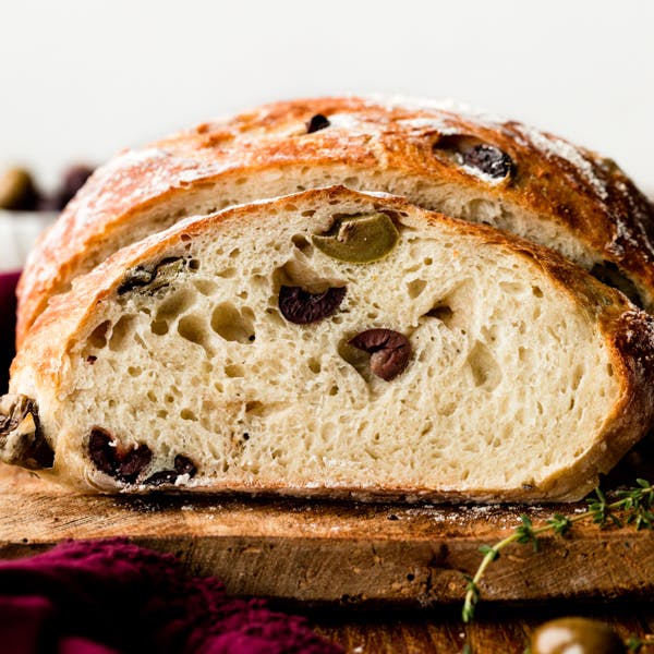 picture of a sliced loaf of olive bread 