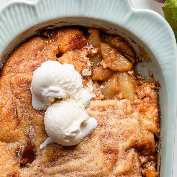 apple cobbler topped with vanilla ice cream