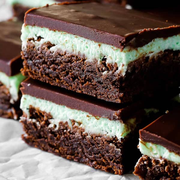Brownies with green mint frosting, covered in chocolate