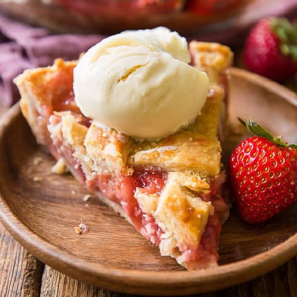 picture of a slice of strawberry rhubarb pie with vanilla ice cream
