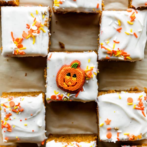 pumpkin bars cut into squares, decorated with halloween sprinkles