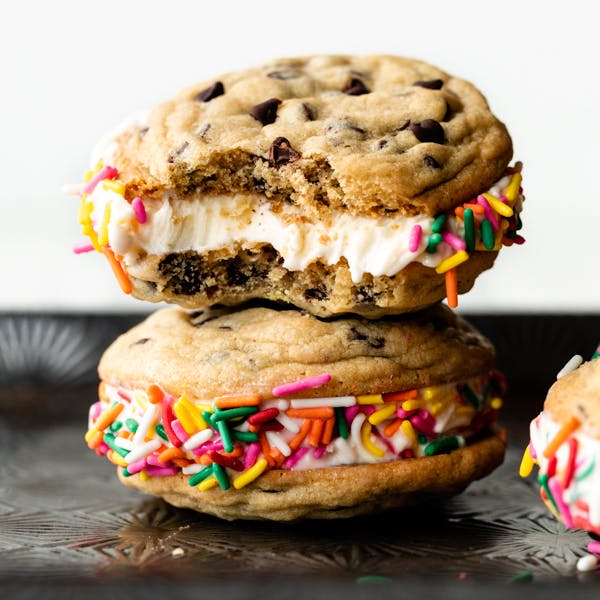 stack of two cookie ice cream sandwiches with rainbow sprinkles