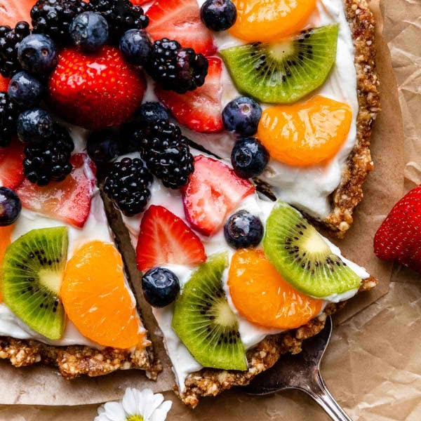 slice of greek yogurt fruit tart with nutty base