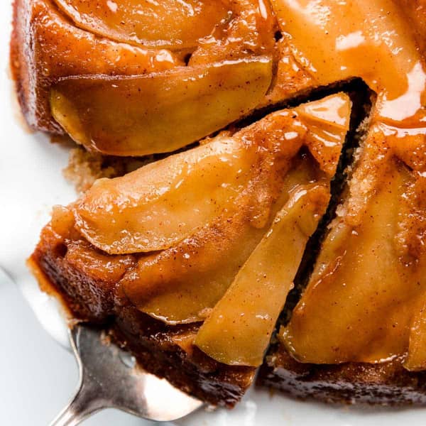 caramel apple upside down cake with a slice being pulled out