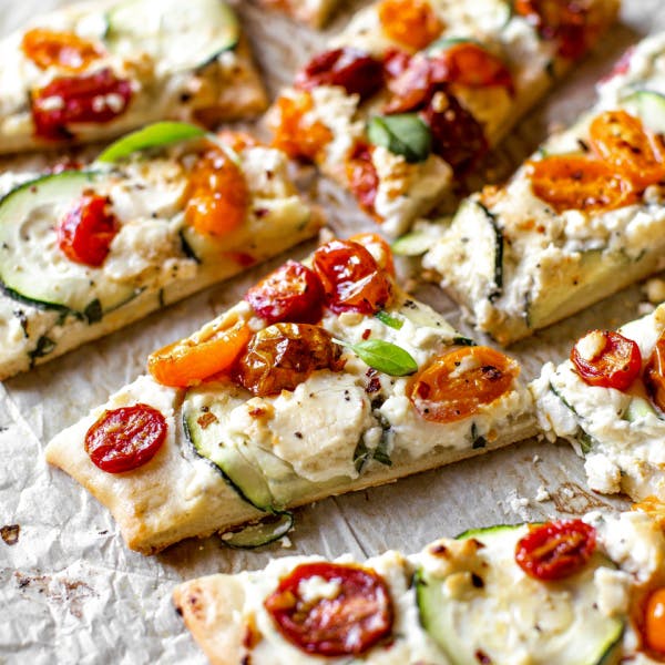 zucchini & herbed ricotta flatbread cut into slices