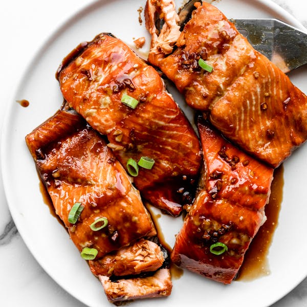 Picture of pieces of glazed salmon on a white plate