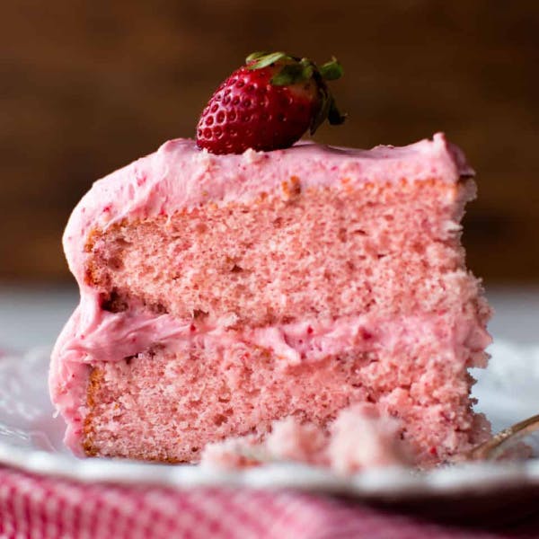 slice of pink cake with pink frosting