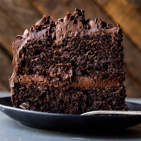 picture of a slice of chocolate zucchini cake on a plate