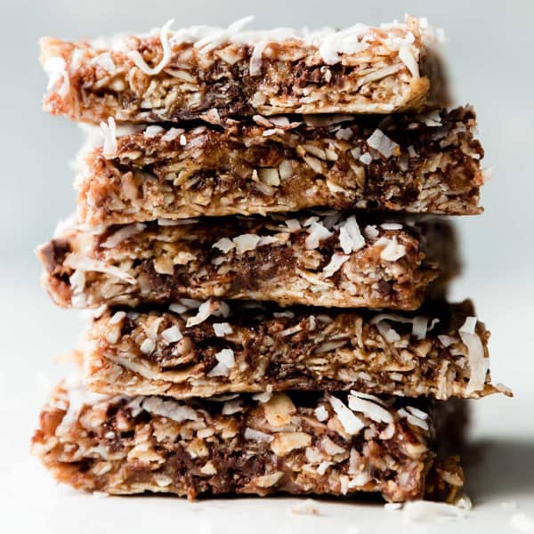 tall stack of granola bars on a white surface