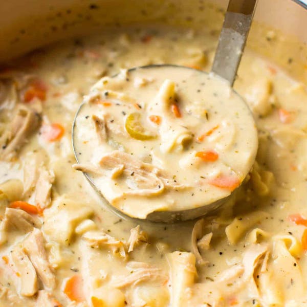 Ladel-full of creamy chicken noodle soup