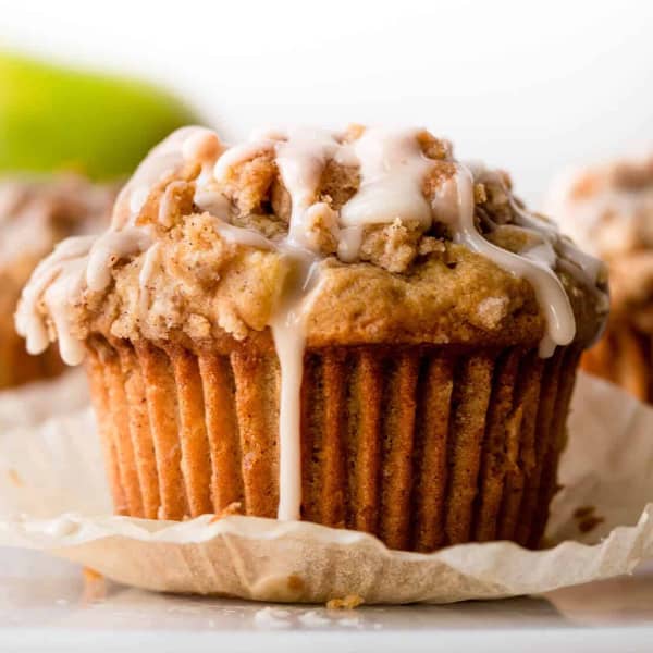 apple cinnamon muffins with crumb topping and vanilla icing