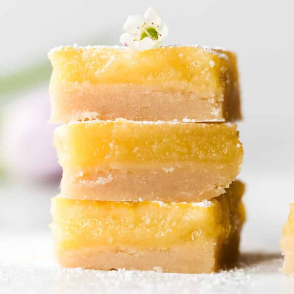 three lemon bars stacked on top of each other