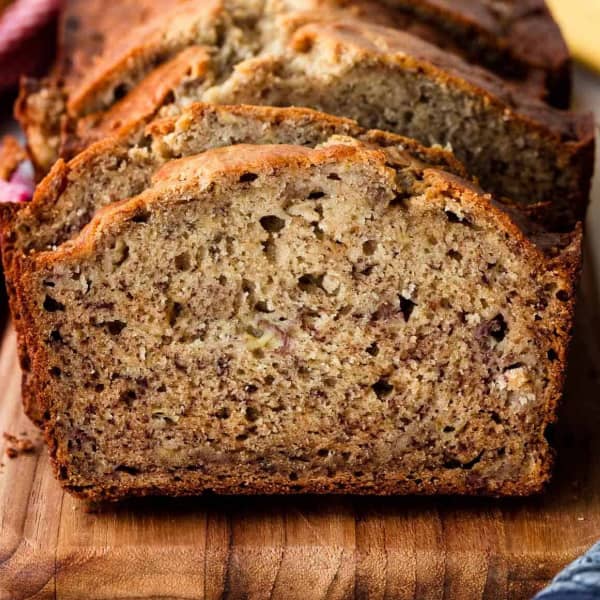 sliced banana bread on a wood cutting board