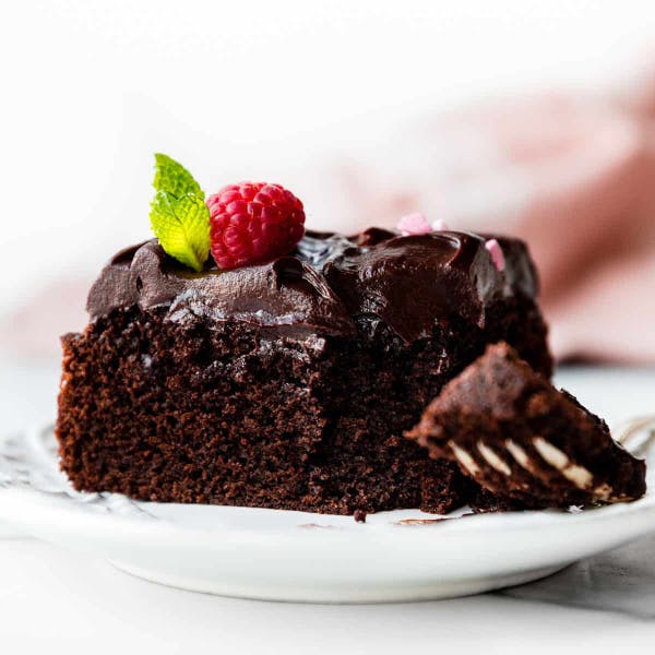 slice of single layer chocolate cake with chocolate ganache topping