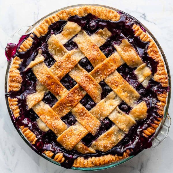 a whole blueberry pie with a lattice top