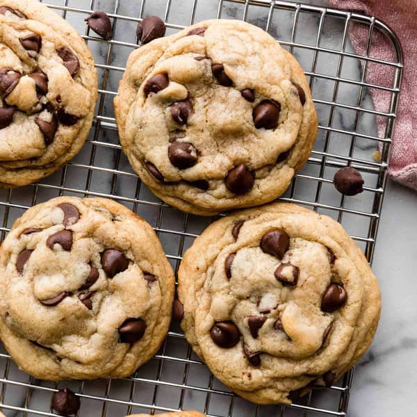 Thick chocolate chip cookies on a cooling rack