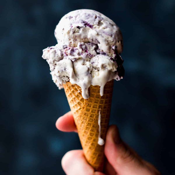 blueberry crumble ice cream in an ice cream cone