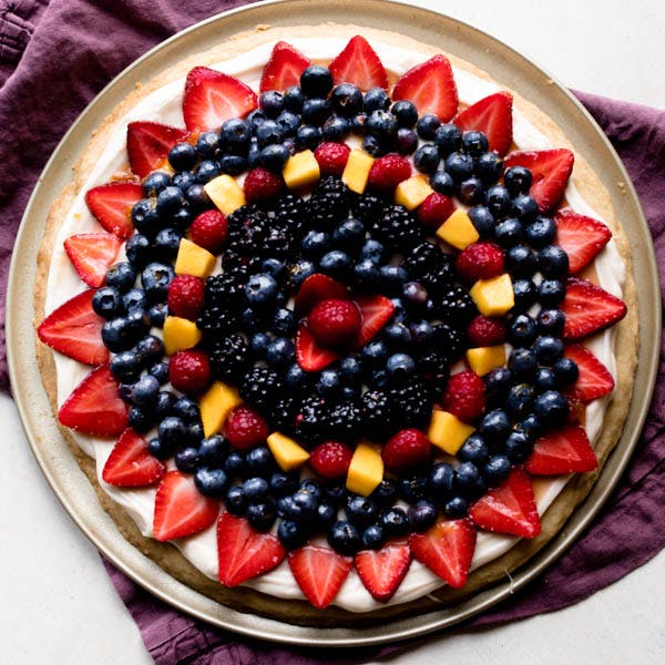 fruit pizza with berries and mango