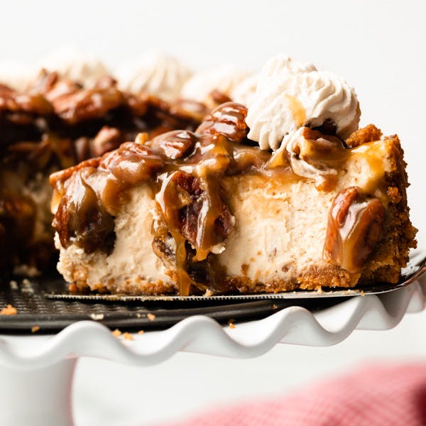 picture of a slice of brown sugar cheesecake with pecan topping