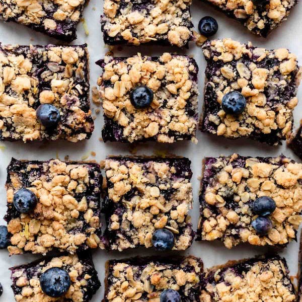 sliced blueberry pie bars with oat crumble topping