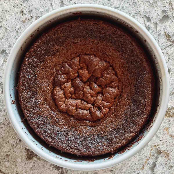 shriveled chocolate cake in cake pan